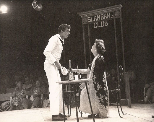 'Gabey' (Dick Button) recognizes 'Madame Dilly' (Kathryn Meisle) at the Slam Bang Club.